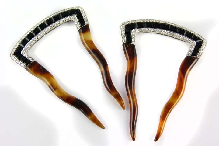 Pair of early 20th century onyx and diamond set hair combs